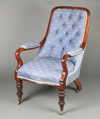 A William IV mahogany open arm chair upholstered in blue buttoned material, raised on cabriole supports 98cm h x 66cm w x 53cm d 