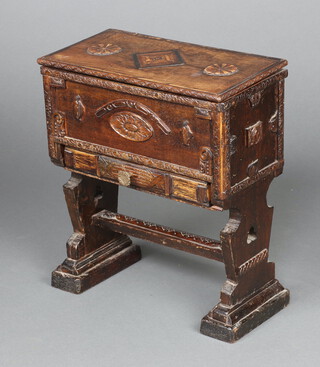 A 17th Century style miniature oak coffer with hinged lid revealing a plush interior, the base fitted a drawer, raised on standard end supports with H framed stretcher 39cm h x 34cm w x 18cm d 