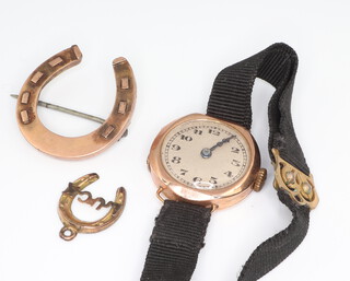 A lady's 9ct yellow gold wristwatch on a silk strap together with a horseshoe brooch and tie pin mount 