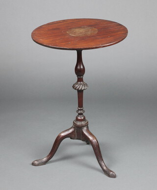 A 19th Century circular mahogany snap top wine table raised on a turned column and tripod base 68cm h x 47cm  