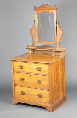 An Edwardian satinwood dressing chest with arched bevelled plate mirror above shelf, the base with 3 graduated drawers, on bracket feet 160cm h x 76cm w x 52cm d 