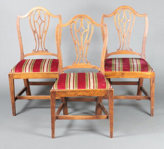 A set of 3 19th Century oak Hepplewhite style camel back dining chairs with pierced slat backs and drop in seats, on square tapered supports, H framed stretchers 95cm h x 51cm w x 42cm d 