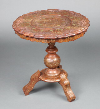 An Indian carved hardwood and inlaid brass wine table, raised on bulbous turned column and tripod base 53cm h x 52cm 