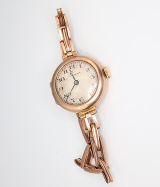 A lady's 9ct yellow gold wristwatch, the dial inscribed James Walker, gross weight including movement and clasp 19.3 grams 