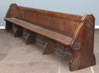 A large and impressive Victorian carved oak and panelled pew by S S Teulon, the aisle end carved a pair of rosettes and with brass plaque to the end marked number 13, 87cm h x 364cm w x 47cm d, this pew was removed from the Horsham Parish Church of St Mary The Virgin   
