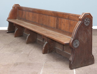 A large and impressive Victorian carved oak and panelled pew by S S Teulon, the aisle end carved a pair of rosettes and with brass plaque to the end marked  number 3, 87cm h x 364cm w x 47cm d, this pew was removed from the Horsham Parish Church of St Mary The Virgin 