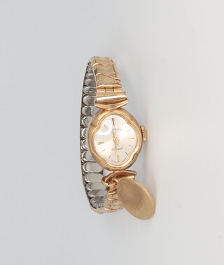 A lady's 9ct yellow gold Rotary wristwatch with 9ct charm on a gold plated bracelet, gross weight 15.3 grams