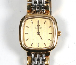 A lady's gold plated Omega wristwatch on a bimetallic bracelet 