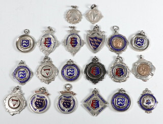 A collection of twenty 1930's silver and enamelled sports fobs, 224 grams 