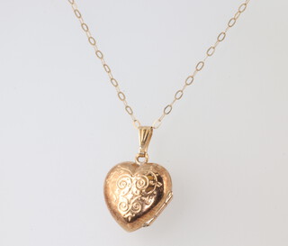 A 9ct yellow gold heart shaped locket and chain, gross weight 2 grams, necklace is 36cm 