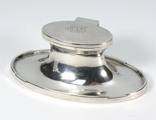 An oval silver ink well with engraved monogram Birmingham 1928, 15cm 