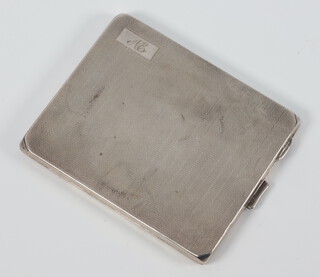 A silver Art Deco cigarette case with engine turned decoration and monogram Birmingham 1933, 160 grams gross 