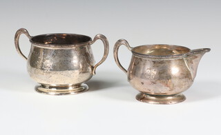 A silver cream jug and a ditto 2 handled bowl Birmingham 1924, maker Hukin and Heath, 188 grams 