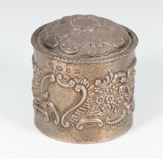 A Victorian circular repousse silver trinket box with floral decoration Birmingham 1897, 7cm, 110 grams 