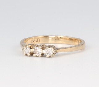 A 9ct yellow gold 3 stone diamond ring approx. 0.15ct, 1.8 grams, size K 1/2 