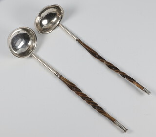 Two Georgian silver whale bone handled ladles, rubbed marks 