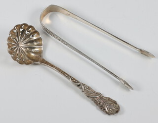 A Victorian silver sifter spoon London 1896 together with a pair of Georgian nips, 68 grams 