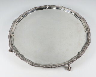 A George V silver salver with scalloped rim on claw and ball feet, London 1913 818 grams 30cm 