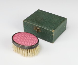 An Edwardian child's oval hairbrush with pink guilloche decoration cased, Birmingham 1902 