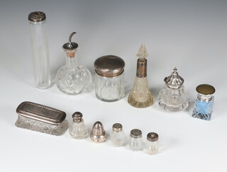 A silver topped toilet jar London 1900 and 11 silver topped bottles etc 