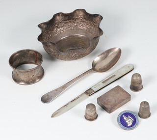 An Indian repousse white metal bowl, napkin ring, 3 thimbles, spoon, fruit knife, badge and box 