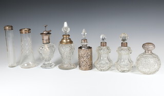 A Victorian silver mounted spherical glass scent bottle (a/f) and 7 other mounted items 