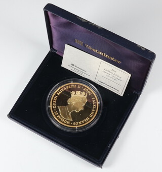 A 2002 Golden Jubilee 22ct gold plated silver commemorative crown 5ozs 