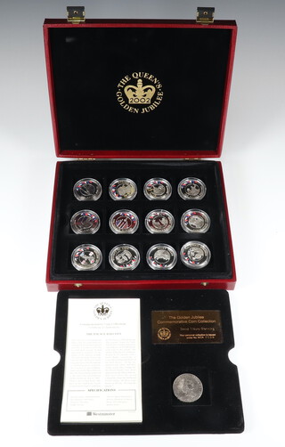 A set of The Golden Jubilee commemorative coin collection comprising 24 silver and enamelled medallions, each 28 grams, 672 grams in total, contained in a fitted box