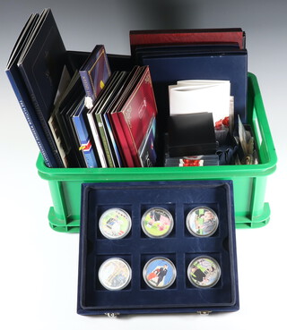 A collection of mixed gilt commemorative coins and crowns 