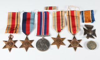 A Second World War medal group comprising War medal, Africa, Atlantic and 1939-45 Star, together with  a commemorative medallion and minor badges 