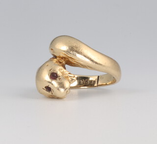 A yellow metal 9ct gold ruby set snake ring, size E 1/2, 5.7 grams 