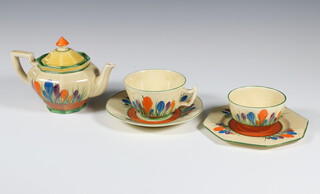 A Clarice Cliff Bizarre Crocus pattern teapot, tea cup and saucer, sugar bowl and octagonal plate