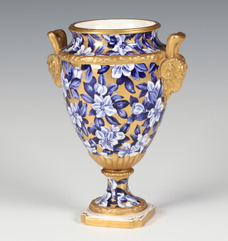 A Coalport 2 handled vase with ram handles, the gilt ground with flowers 11cm 