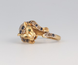 An 18ct yellow gold diamond and sapphire set leopard ring 4.4 grams, size J   