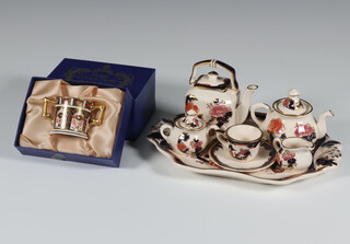 A Masons Mandalay miniature tea set comprising teapot, coffee pot, sugar bowl and cover, tea cup and saucer, cream jug and tray together with a Royal Crown Derby miniature 2 handled Rye pattern cup 3.5cm 