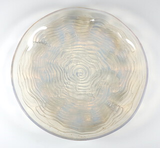 A Lalique opalescent fish bowl with fish amongst waves, etched R LALIQUE 30cm diam.