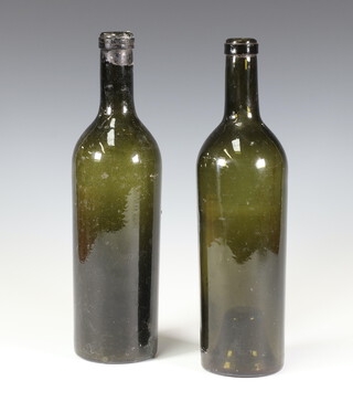 Two 19th Century green glass wine bottles 29cm 