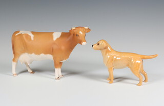 A Beswick Guernsey cow no.1248B matt, modelled by Arthur Greddington 10.8cm, together with a ditto Labrador gloss, modelled by Arthur Greddington 8.3cm 