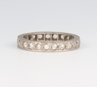 A white metal diamond eternity ring, 3.4 grams, size L 