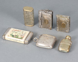 An advertising vesta case for Thomas Green and Sons Ltd (some rubbing),  a metal vesta case in the form of a book, a metal stamp/vesta case in the form of a book (hinges f), silver plated vesta case, a pierced gilt metal vesta case and 1 other in the form of a bottle