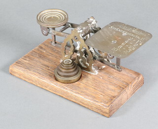 A pair of brass letter scales complete with 6 weights marked Avery 