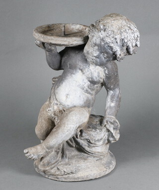 A 19th/20th Century cast lead garden fountain in the form of a seated cherub supporting a saucer 34cm h x 20cm 