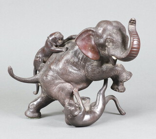 A Japanese Meiji bronze of an elephant encountering tigers 15cm x 22cm x 10cm, the base with seal mark 