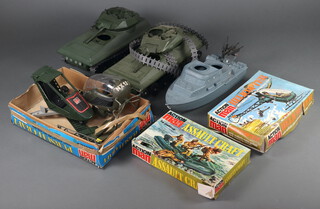 Action Man by Pallitoy, a collection vehicles to include assault craft 34132 boxed, helicopter 34714 boxed,  pursuit craft 34738 boxed together with 2 tanks and a Cherilea  gun ship  