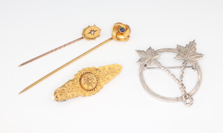 A 15ct yellow gold bar brooch, 2 tie pins and a silver brooch, gross weight 2.7 grams 