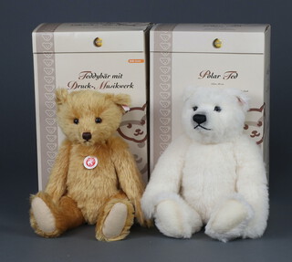 A Steiff limited edition bear with a press-and-listen musical-box no.557 of 3000 30cm boxed and with certificate and 1 other Polar Bear no.75 of 2000, 40cm, boxed  