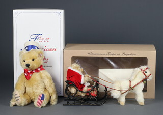 A Steiff limited edition Father Christmas teddy bear with pony sledge no.479 of 4000, boxed and with certificate and a First American Teddy no.07556 38cm boxed 