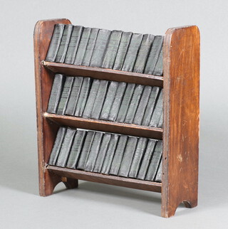 Forty miniature editions of "The Works of Shakespeare" by Allied Newspapers Ltd. contained in an oak finished 3 tier book rack (the back has been glued and repaired)