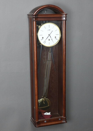 A Kieninger, a German chiming regulator with 16cm dial, subsidiary second hand, contained in an arch shaped mahogany case 96cm h x 27cm w x 17cm d 