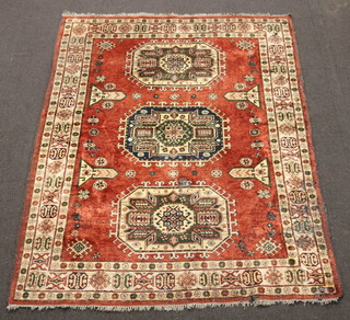 A brown and white ground Afghan rug with 3 octagons to the centre 203cm x 161cm 